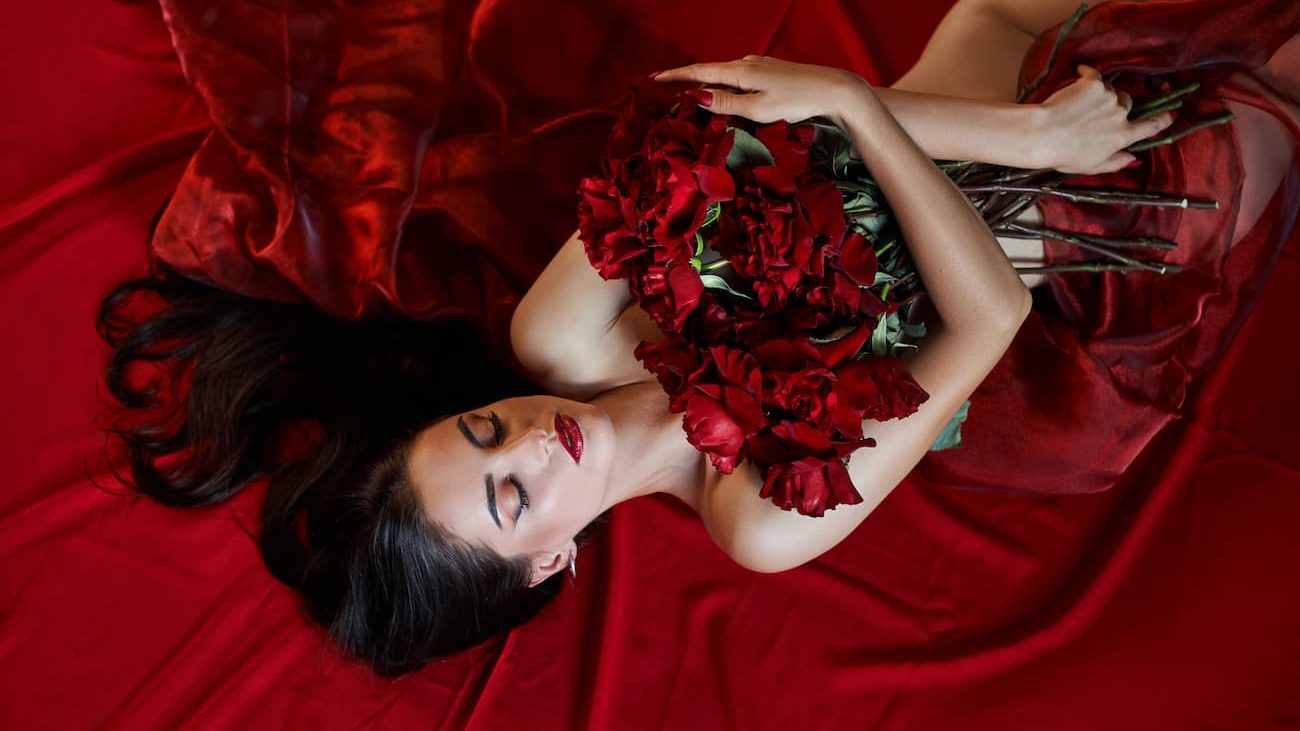 Sexy brunette with a bouquet of flowers.